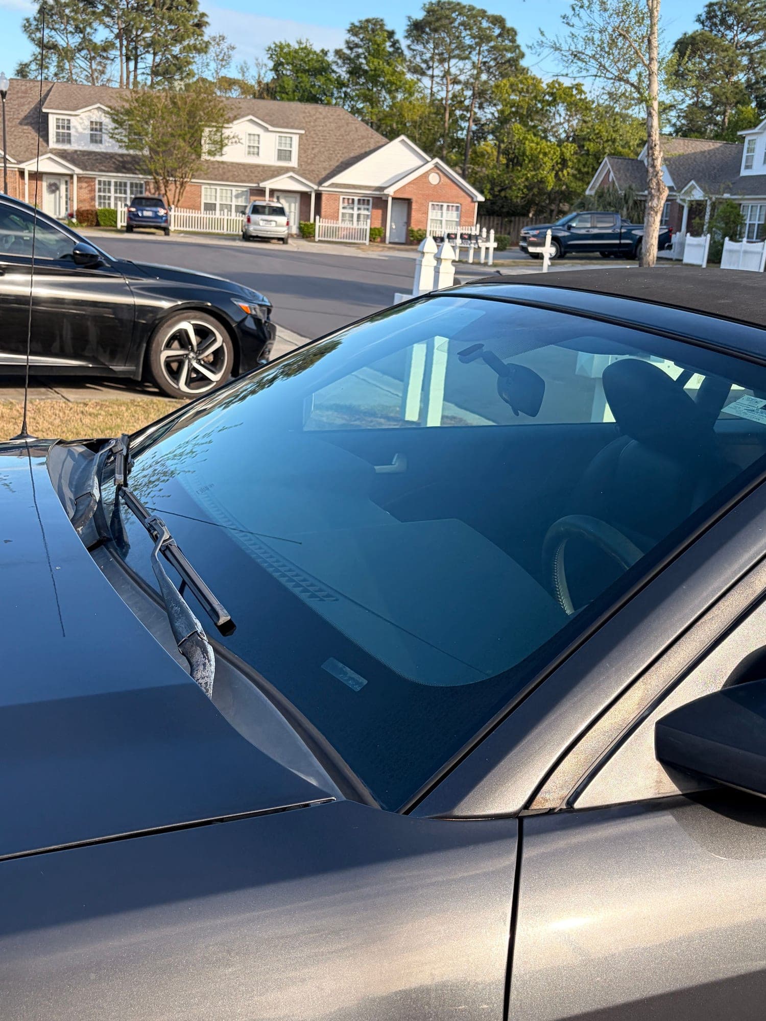 The same windshield left crystal clear and streak-free after detailing